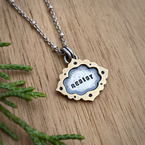 “Resist” Ornate Frame Necklace / 18”