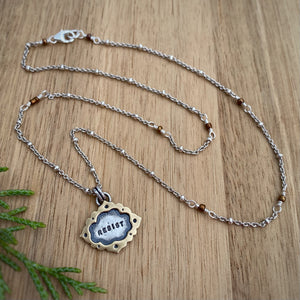 “Resist” Ornate Frame Necklace / 18”
